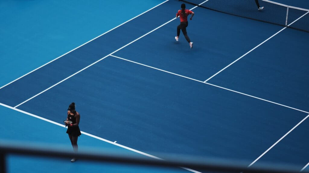 two persons playing tennis