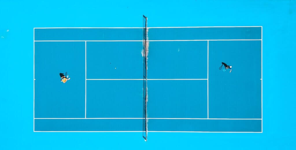 two person playing tennis